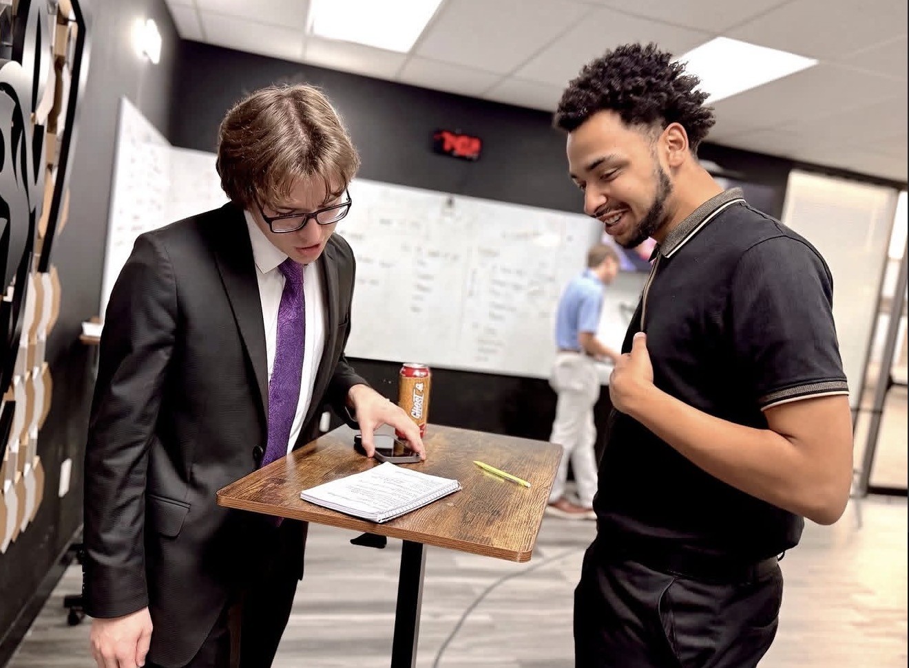 Second Wind Acquisitions team members reviewing strategy documents